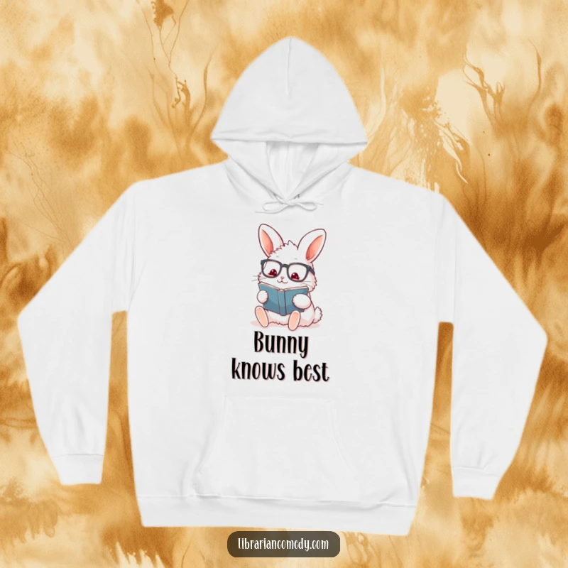 Funny rabbit with glasses stamping a book on a cozy hoodie, indicating warmth and reading passion, a funny gift.